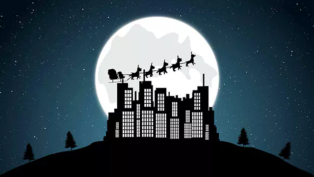 Santa sleigh flying over the buildings